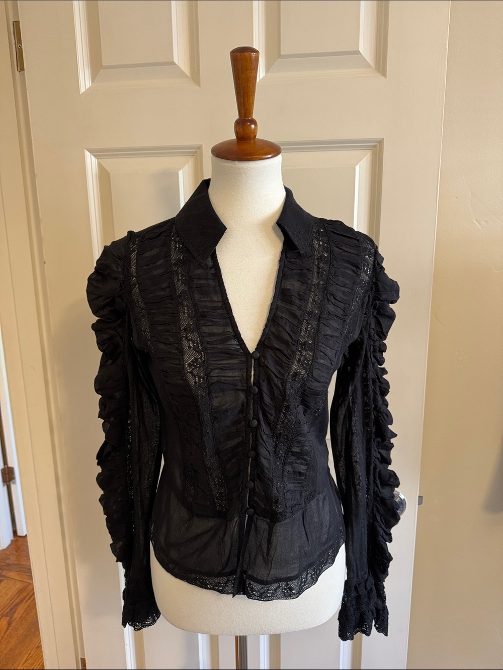 Pristine Women’s Black Ruffled Button-Front Blouse sold out at store and online